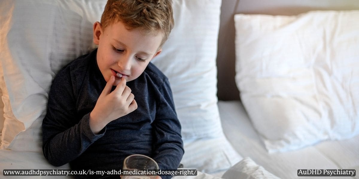 Young child preparing to take medication in bed, representing the importance of monitoring ADHD treatment response in children.