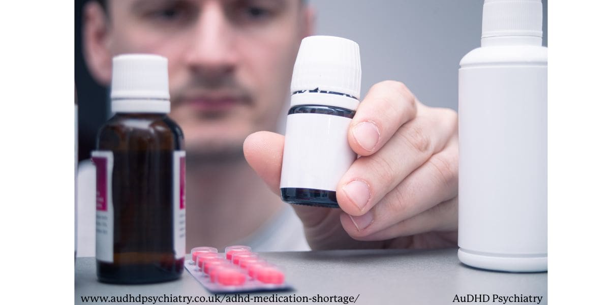 Close-up of a person organizing ADHD medication bottles and tablets, highlighting the importance of safe storage during the UK medication shortage