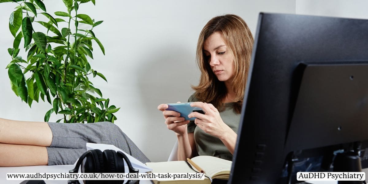 Woman distracted by phone showing behavioral symptoms of ADHD task paralysis