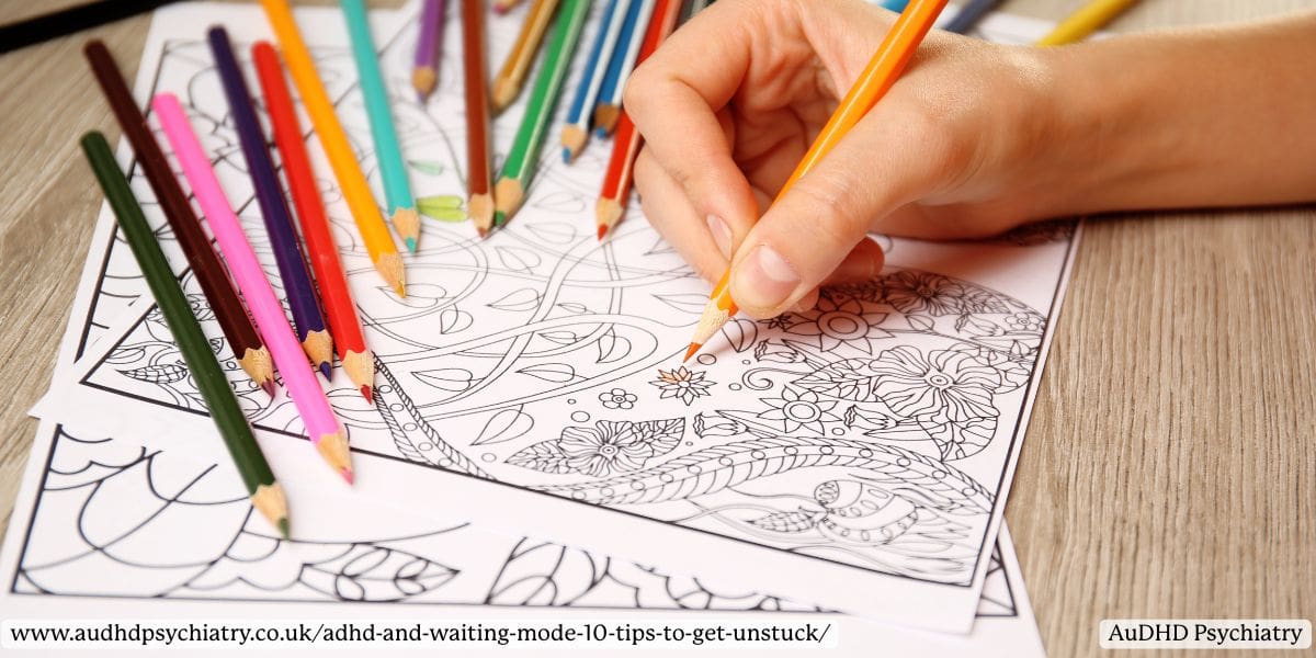 Close-up of a hand using coloured pencils on an adult colouring book, showing a calming activity from an ADHD waiting mode survival kit