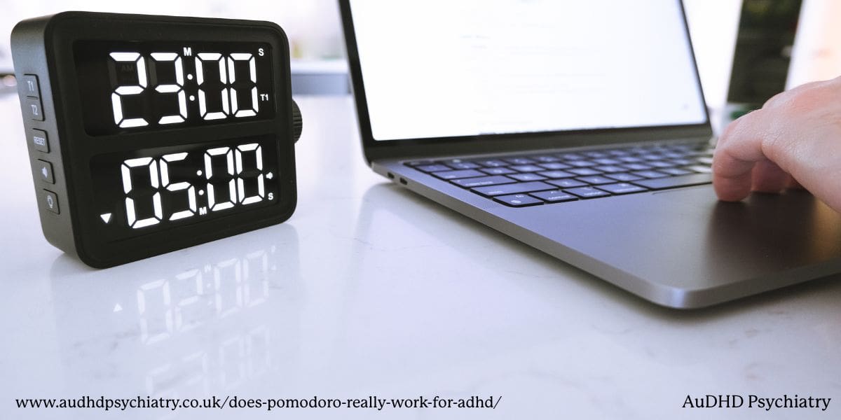 Digital visual timer counting down next to a laptop, used to support ADHD-friendly Pomodoro sessions.