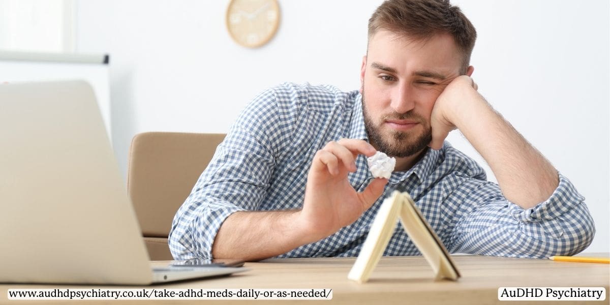 adult man with ADHD holding crumpled paper experiencing executive dysfunction while working