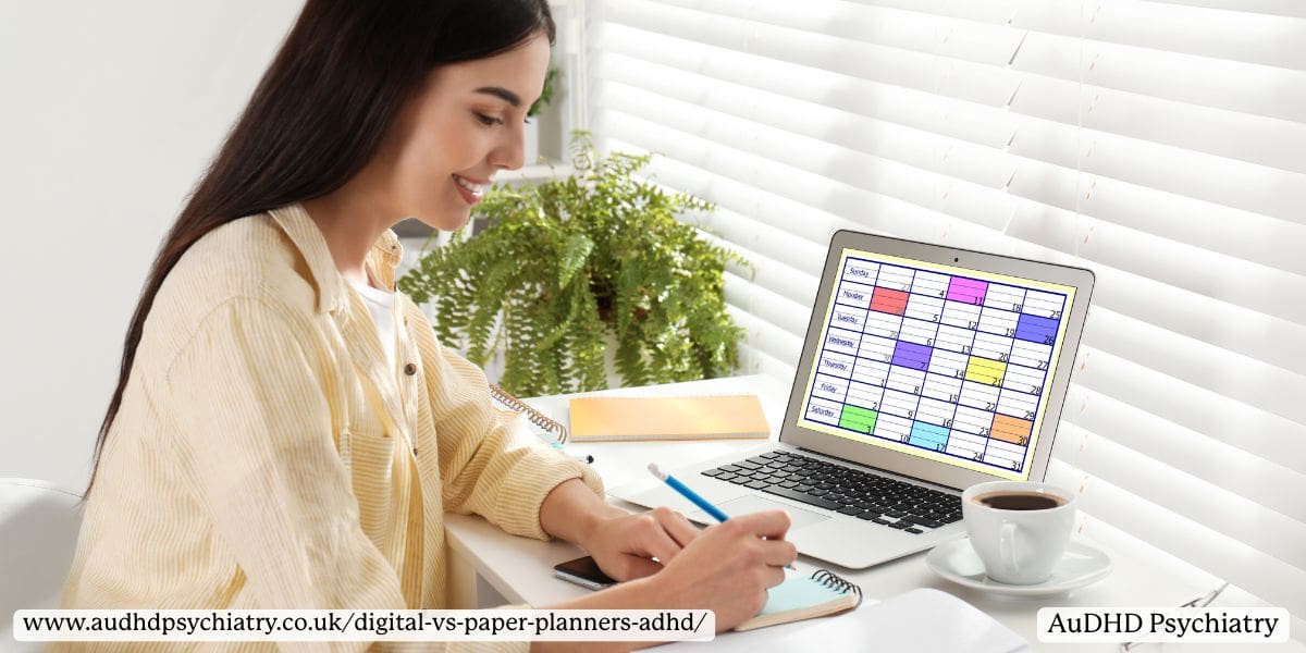 Smiling woman using an ADHD planner notebook while referencing a colour-coded weekly ADHD planner on her laptop