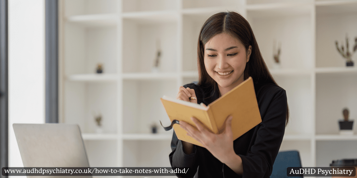 Smiling student using a journal method – engaging way to take notes with ADHD.