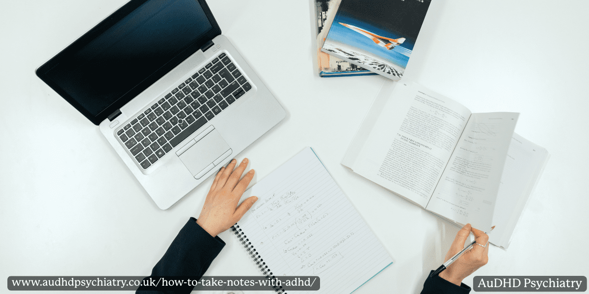 Notebook and laptop with open book – mixed handwritten and digital notes for ADHD.