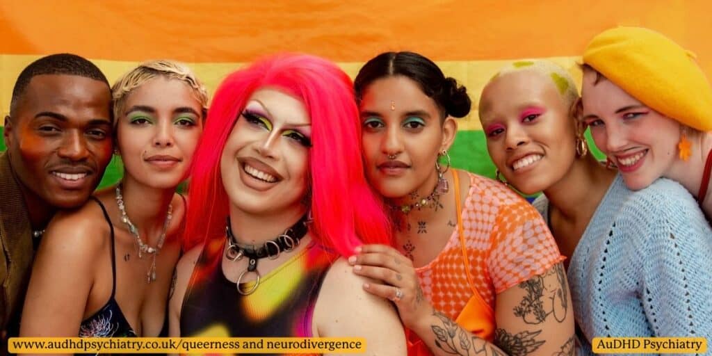 Diverse LGBTQ+ individuals posing together in front of rainbow Pride background