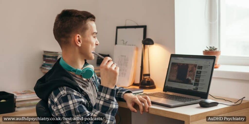 Young man watching ADHD content on YouTube with headphones nearby, included in our roundup of podcasts and channels.