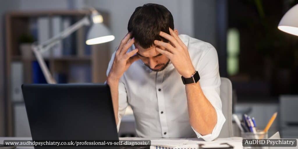 Man frustrated at laptop illustrating risks of ADHD self diagnosis