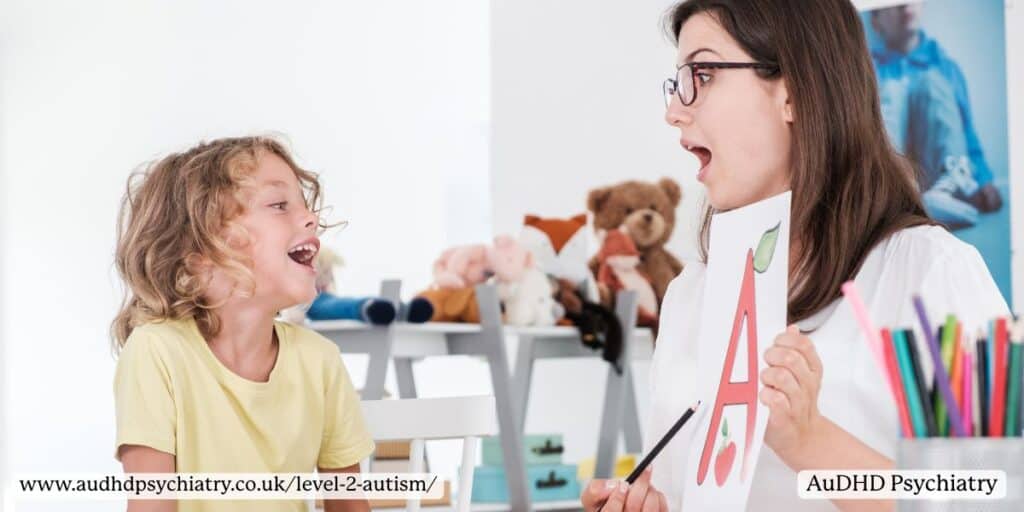 Speech therapist teaching child letters – communication therapy for Level 2 autism