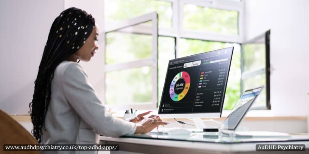 Woman analysing expenses on computer – ADHD apps for productivity and financial management