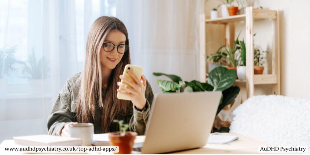 Woman working with phone and laptop – top ADHD productivity and planning apps