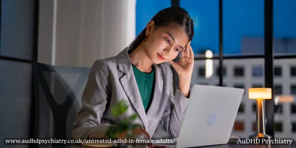 Woman working late at night – hyperfocus and fatigue from untreated ADHD in women