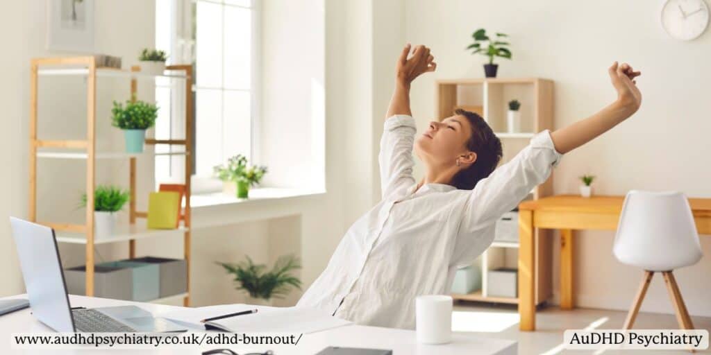 Woman stretching at desk – ADHD burnout recovery and relaxation strategies