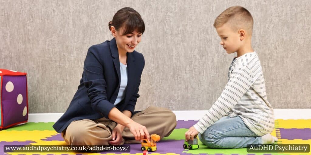 Therapist and young boy playing with toy cars during a session, illustrating early intervention for ADHD in boys