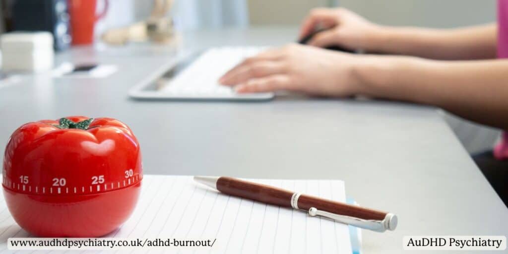 Pomodoro timer and notebook on desk – time management tools for ADHD recovery