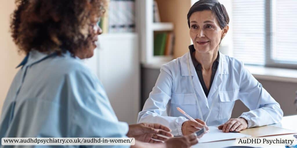 Woman talking with a healthcare professional during an appointment, showing the diagnostic journey for AuDHD in women