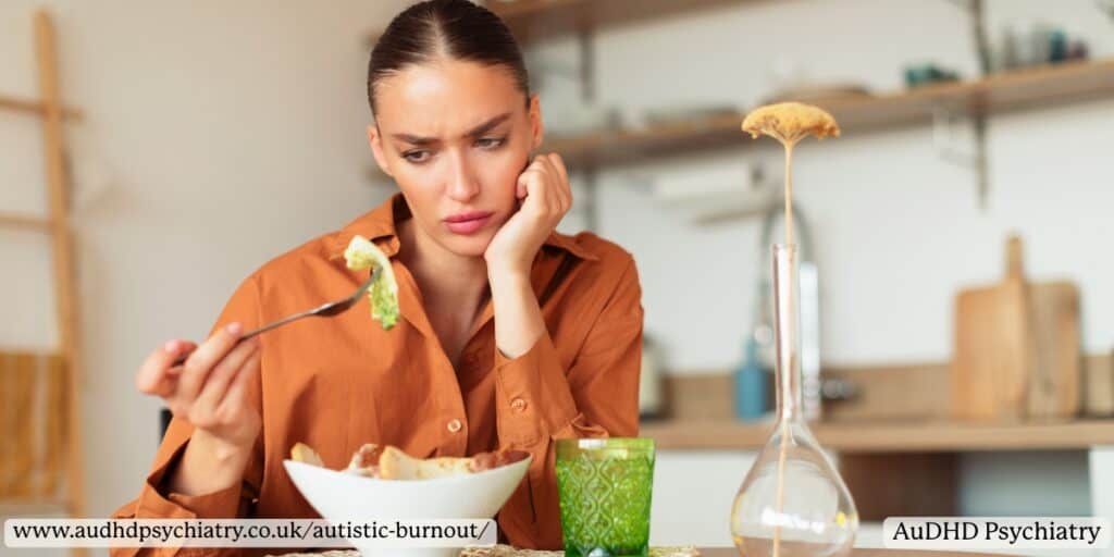 Woman looking disinterested in meal – loss of appetite and motivation during burnout