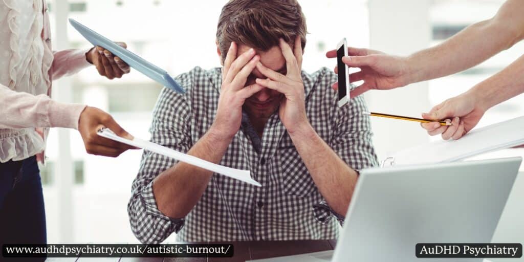 Man overwhelmed by multiple demands at work – signs of autistic burnout
