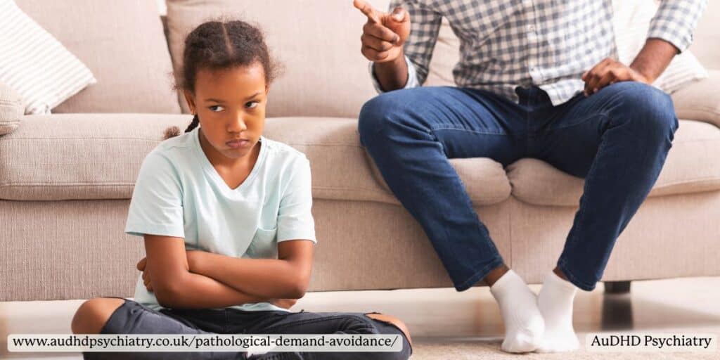 Young child refusing instructions while a parent points, showing demand avoidance behaviours associated with PDA