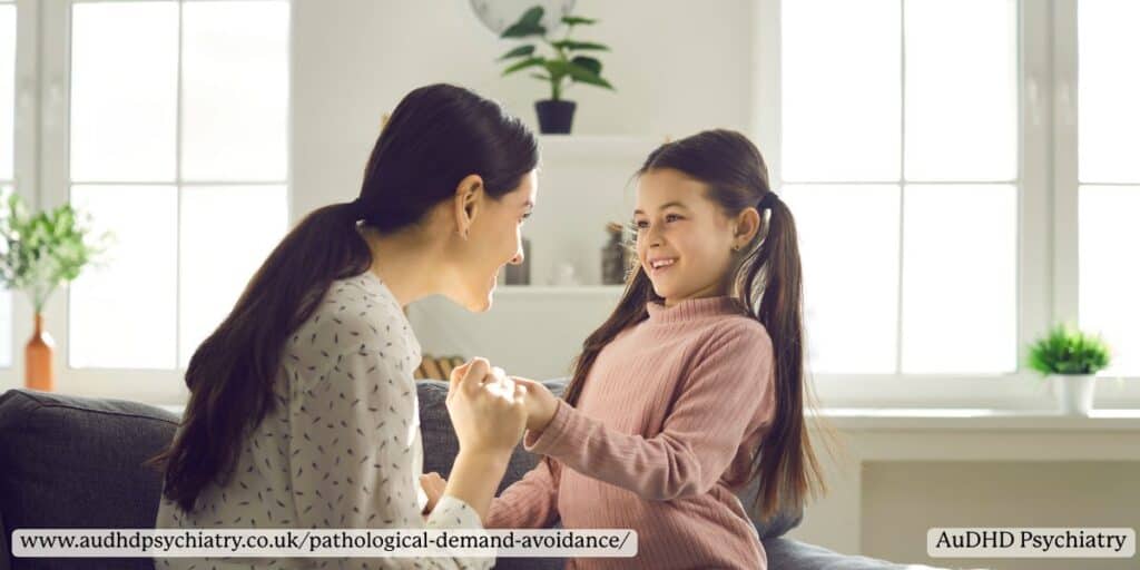 Mother supporting her smiling daughter at home, showing gentle approaches that help with pathological demand avoidance