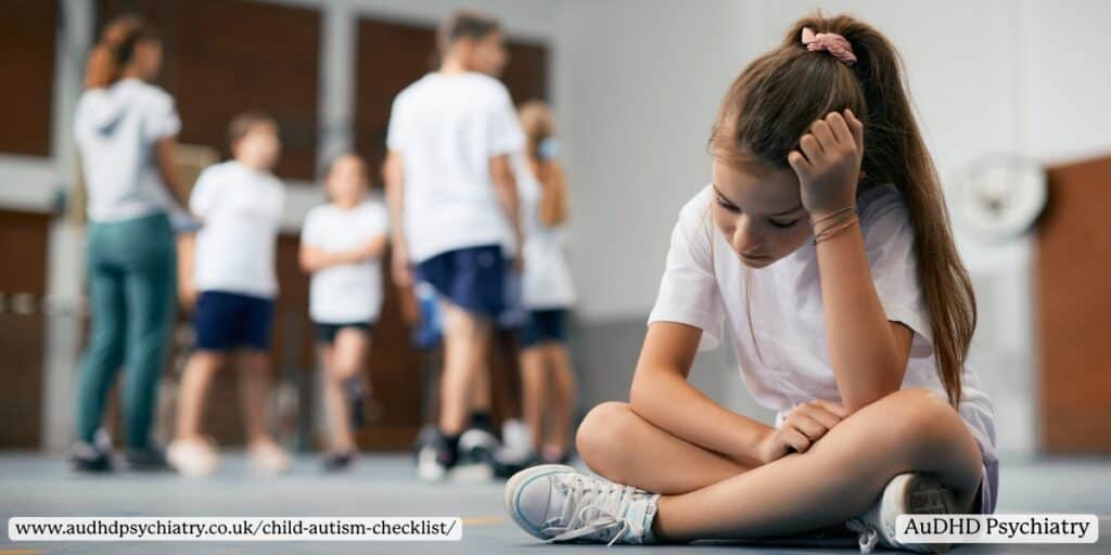 Child sitting alone in a school environment, reflecting social challenges sometimes noted on a child autism checklist