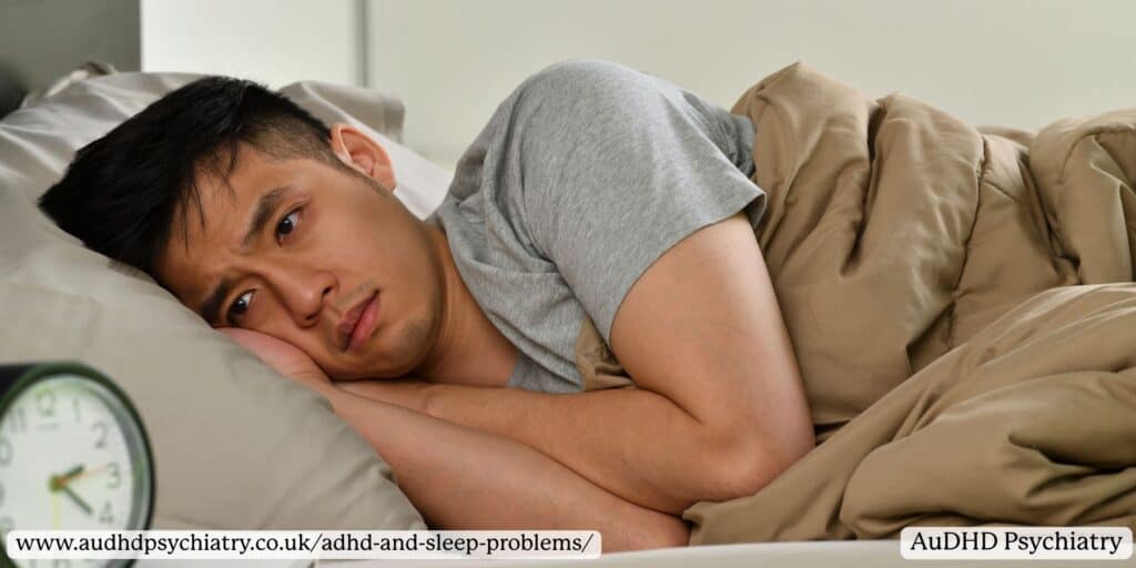 Man lying awake looking tired and unable to sleep, showing common ADHD and sleep problems in adults