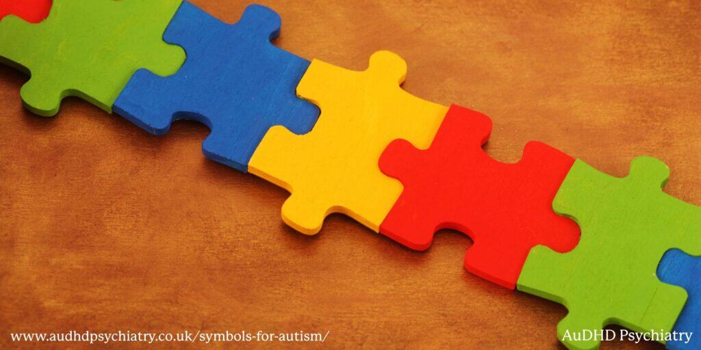 Colourful interlocking puzzle pieces symbolising traditional autism awareness imagery