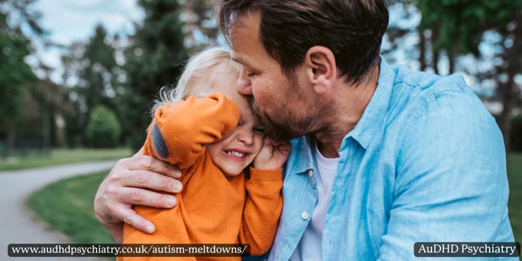Parent comforting autistic child during emotional distress and meltdown