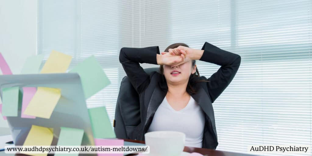 Office worker experiencing sensory overload and autism meltdown symptoms at work