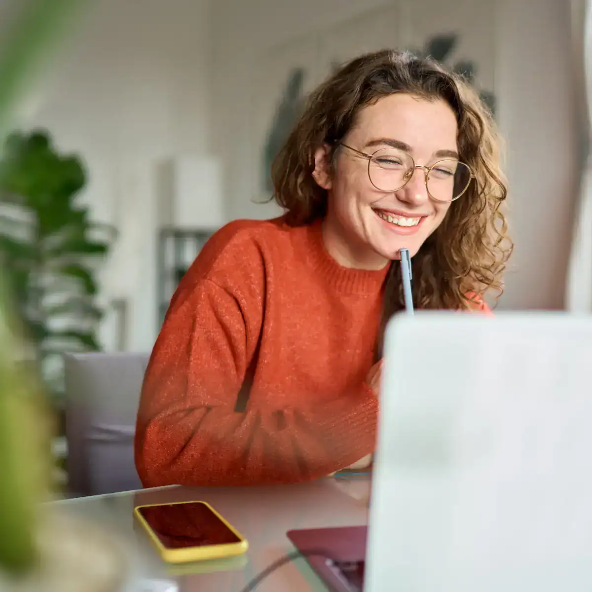 Woman smiling during her free ADHD assessment consultation call